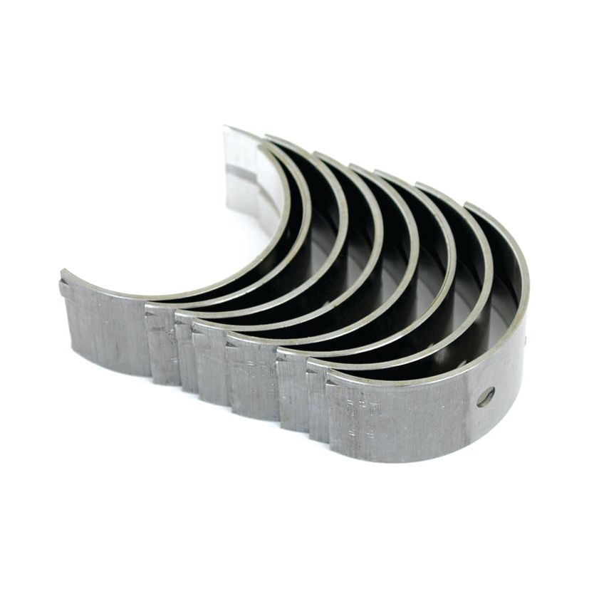 A set of seven semi-circular metal engine bearings, compatible with Case IH and David Brown models, from the brand Sparex (Main Bearing Std. Set, Sparex Part No. S.57526), arranged in a staggered stack on a white background.