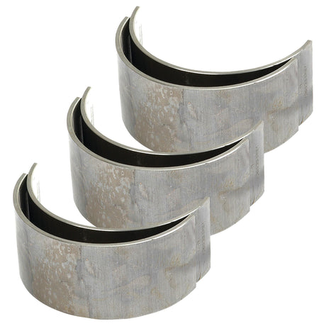 Three Conrod Bearing Std. Sets, Sparex Part No. S.57638, displayed in a staggered formation showing the inner and outer surfaces—perfect for those seeking reliable International Harvester or Case IH parts from Sparex.