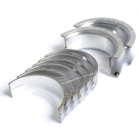 A set of eight quality-crafted Main Bearing Std. (Set) shells, arranged in a staggered stack on a white background—ideal for your Case IH repairs, offered under Sparex Part No. S.57654 from Sparex.