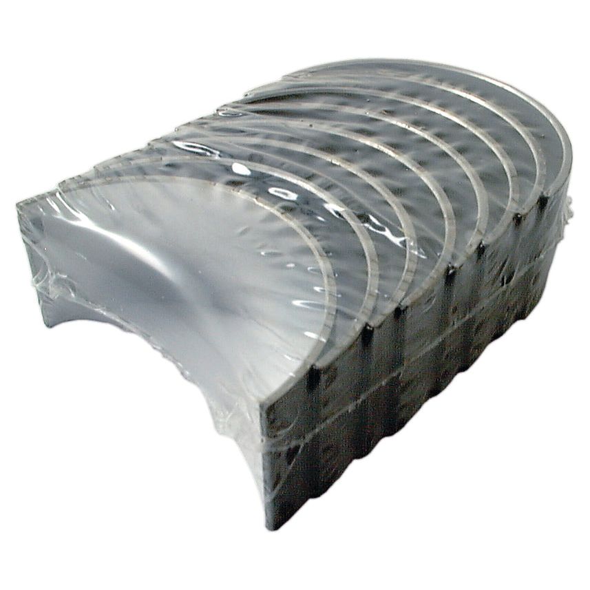 A set of semi-circular metal engine bearings, Conrod Bearing Std. Set (Sparex Part No. S.57799), stacked together and wrapped in clear plastic, ideal for Case IH and International Harvester machinery by Sparex.