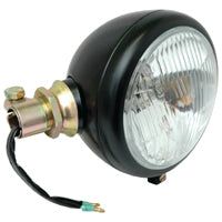 The Sparex Head Light (Halogen), LH, LH Dip, 12V - S.58792 is a round, black metal automotive headlight with a clear glass lens and attached wires. It's designed for vehicle lighting and features a Halogen bulb for enhanced brightness.