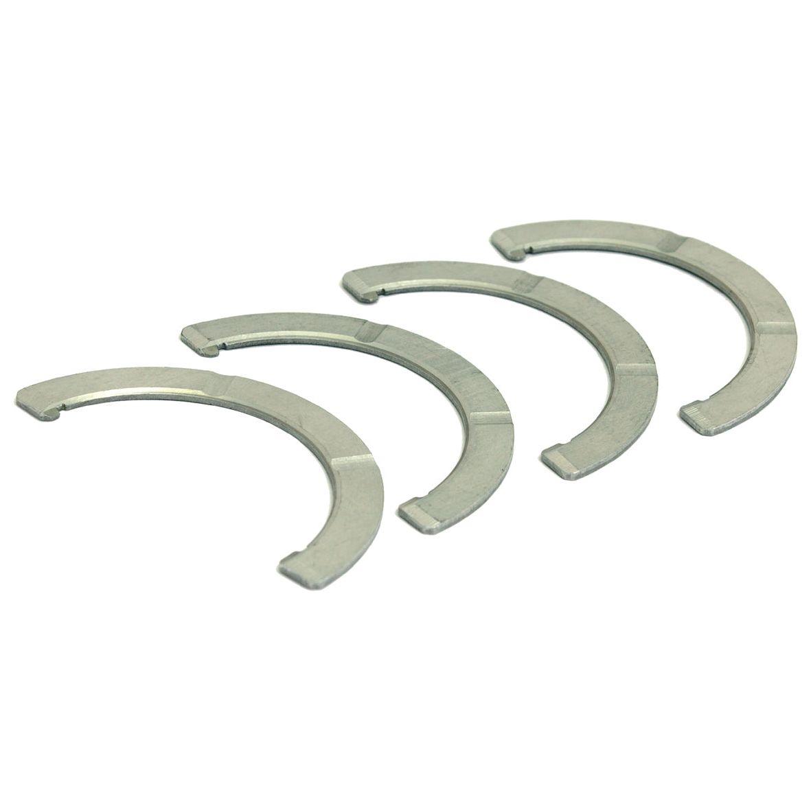 A Sparex Thrust Bearings Set (Part No. S.58820) consisting of four silver crescent-shaped washers is neatly arranged in a row on a white background.