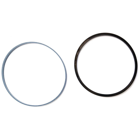 Two circular rubber bands, one gray and one black, lie on a white background, reminiscent of the durable components found in Sparex Seal Kits (Lift Cylinder 100m Piston) used in John Deere machinery (Sparex Part No. S.58847).