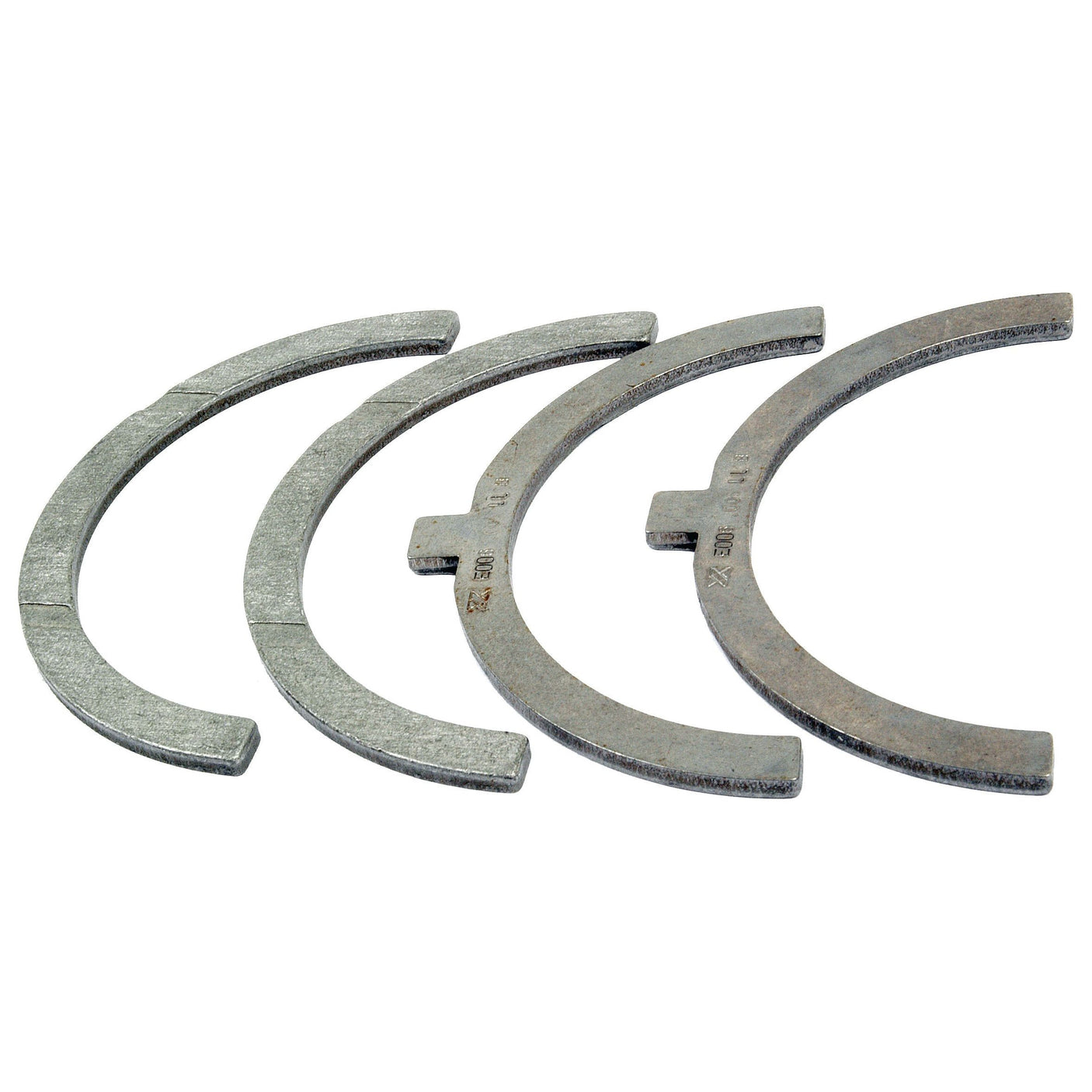 Four semicircular metal pieces from the Thrust Bearings Set +0.25mm (Sparex Part No.S.58943) by Sparex are arranged in a row.