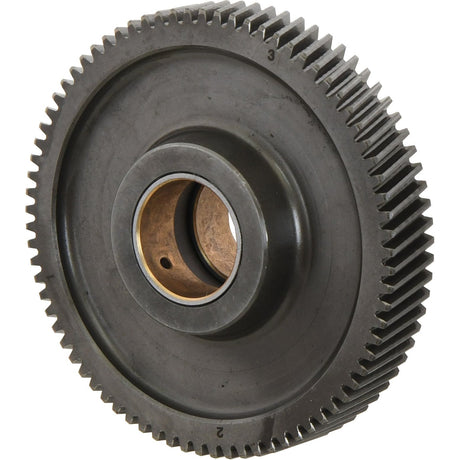 Close-up of the Sparex Idler Gear - S.59079, a black metal gear featuring 77 finely detailed teeth and a central hole, showcasing its mechanical structure. The gear has an outer diameter (OD) of 121.6mm and a width of 20mm, emphasizing its intricate texture.