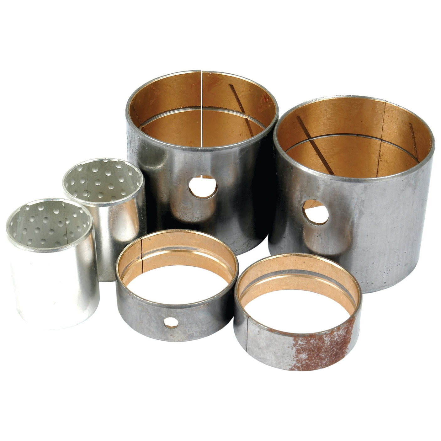 Various cylindrical metal bushings with different sizes and holes are arranged together, resembling components likely used in mechanical or industrial applications. These could be parts from a Spindle Bush (Sparex Part No.S.59525) for something like a Case IH / International Harvester or a McCormick CX.