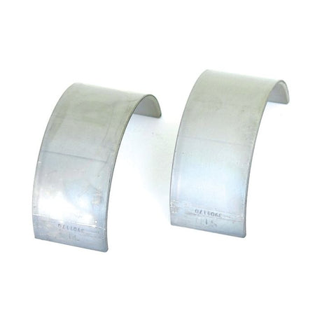 Two upright metal bearing shells, labeled Conrod Bearing Std. Pair | Sparex Part No.S.59554, stand against a white background.