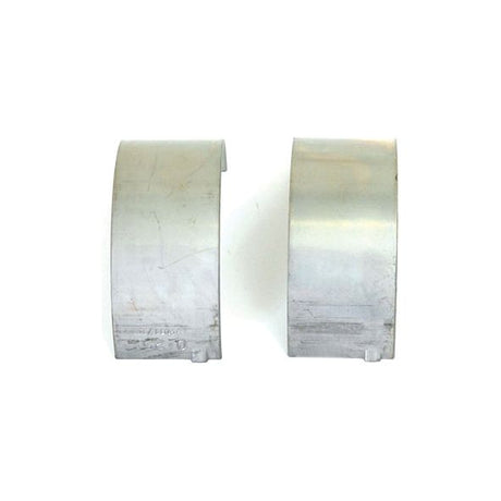 Two Conrod Bearings +0.010'' (0.25mm) from Sparex, part number S.59555, are shown against a white background. These high-quality components feature a slightly curved rectangular shape and are ideal for use in machinery from Sparex or brands like Case IH and International Harvester.
