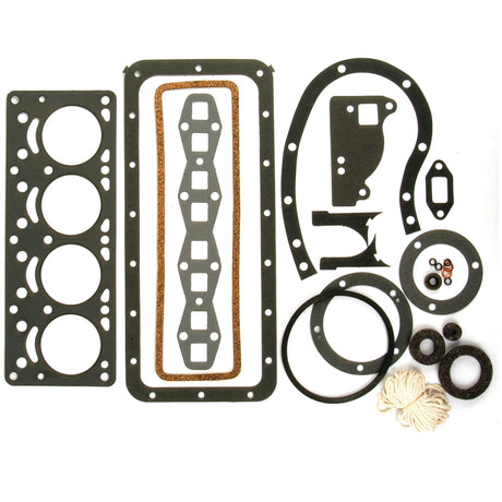 A Complete Gasket Set - 4 Cyl. by Sparex (Part No. S.61501), featuring various engine gaskets and seals in circular, rectangular, and irregular shapes compatible with Massey Ferguson models, laid out on a white background.