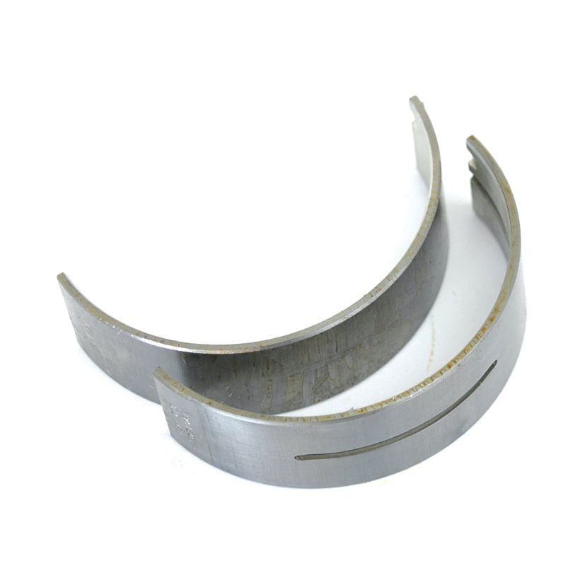 Two semi-circular metal engine bearings from Sparex, part number S.62048, show surface wear and scratches and are compatible with Allis Chalmers machinery. These Main Bearings +0.010" (0.25mm) come as a pair.