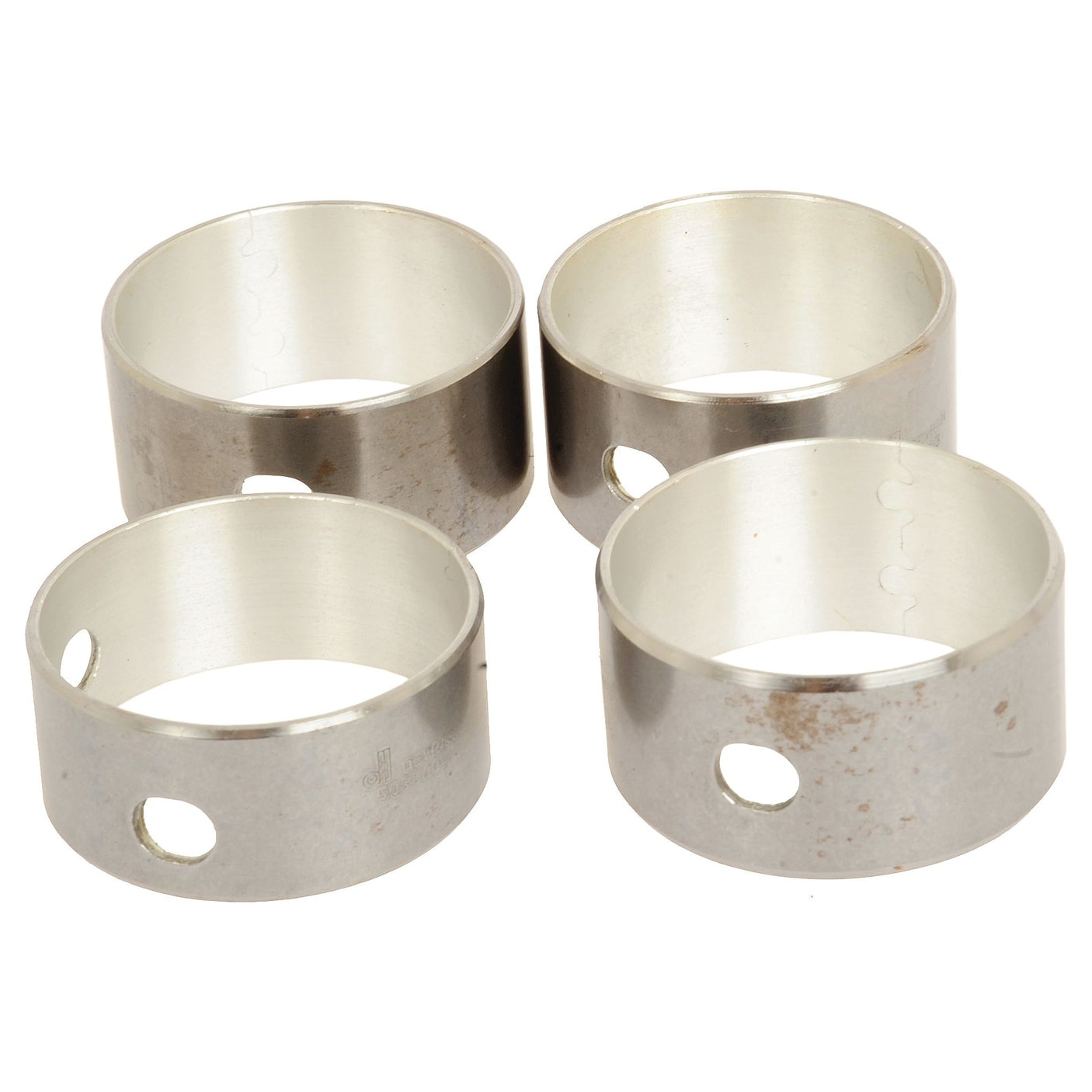 Four metallic cylindrical rings with circular holes, arranged in a square pattern, are part of the Camshaft Bush Kit - S.62122 by Sparex.