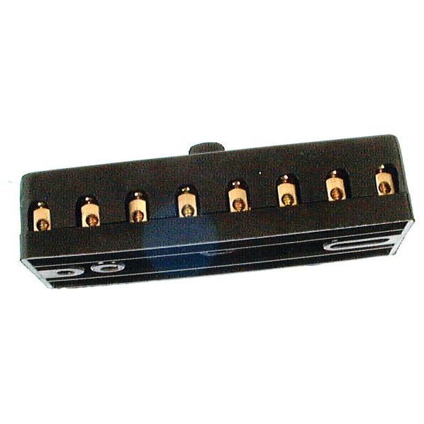 A fuse box from Sparex, with gold-colored screw terminals visible through the black housing, reminiscent of intricate parts found in old tractor models.