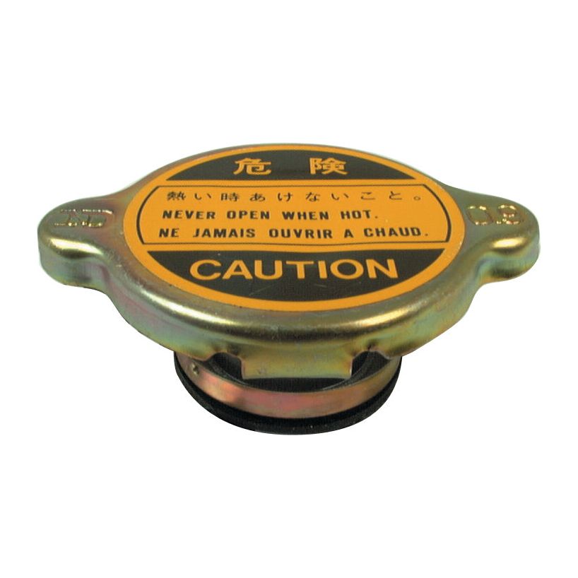 Close-up of a metallic Radiator Cap from Sparex (S.63104) with bilingual safety warnings in English, Japanese, and French stating "Never open when hot" and "Ne jamais ouvrir à chaud," along with the word "Caution.