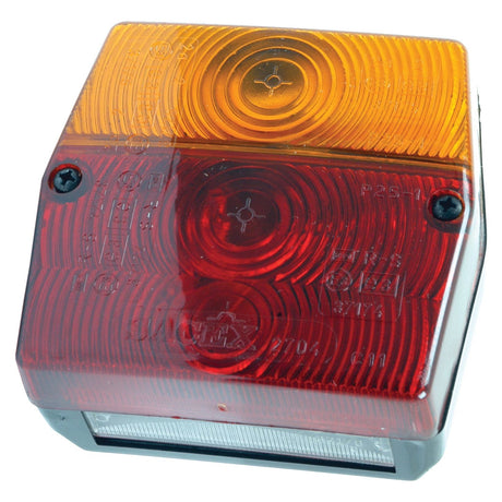 Introducing the Sparex Rear Combination Light (Halogen), S.6320: a square vehicle tail light with amber and red lenses, black screws, and circular patterns. It features a white rectangular section at the bottom and is equipped with a halogen replacement bulb. Suitable for both RH & LH positions, this multifunctional light operates on 12/24V and supports brake, tail, indicator, and number plate functions.