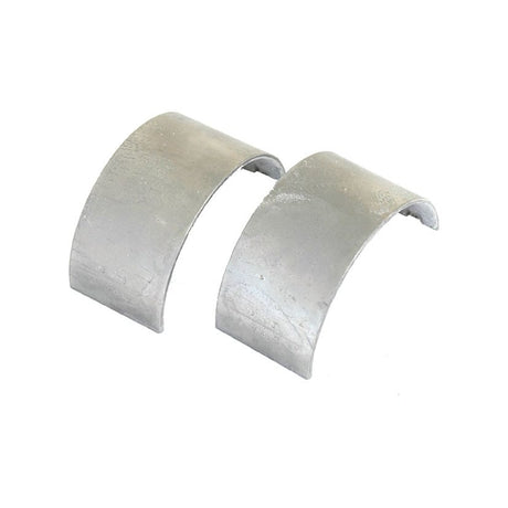 Two curved, metallic Conrod Bearing Std. Pair (Sparex Part No. S.64184), reminiscent of finely cut crystal, positioned side by side against a plain white background.