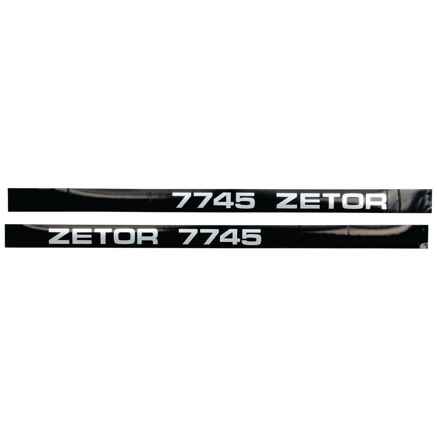 The Decal Set - Zetor 7745 by Sparex (Part No. S.64403) includes two black strips with white text; "7745 ZETOR" on the top strip and "ZETOR 7745" on the bottom strip, creating a stylish decal set.