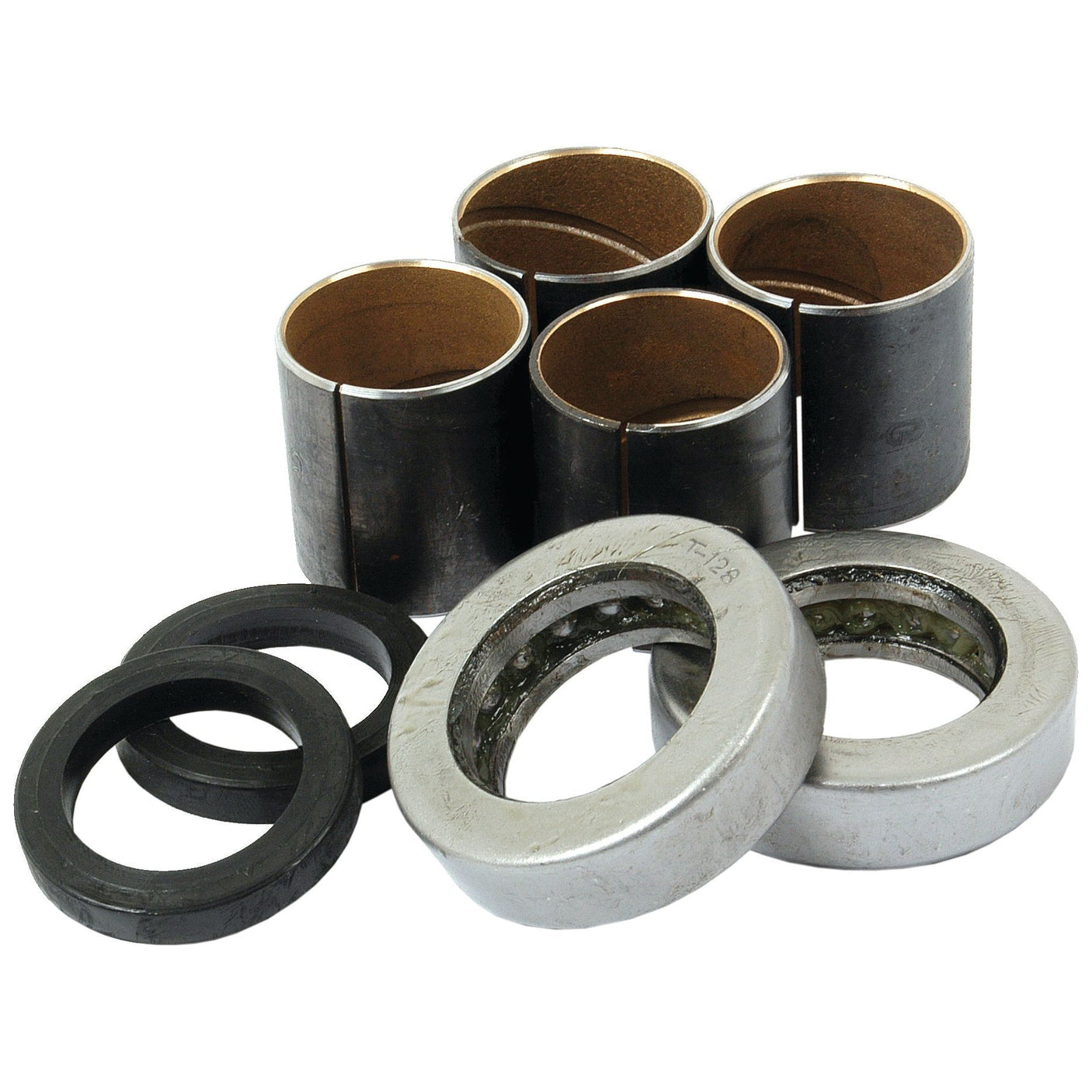 Image of a Sparex Spindle Repair Kit (Sparex Part No. S.65106) for Ford/New Holland tractors, showcasing four cylindrical bushings, two metallic washers, and two black rubber seals neatly arranged on a white background.