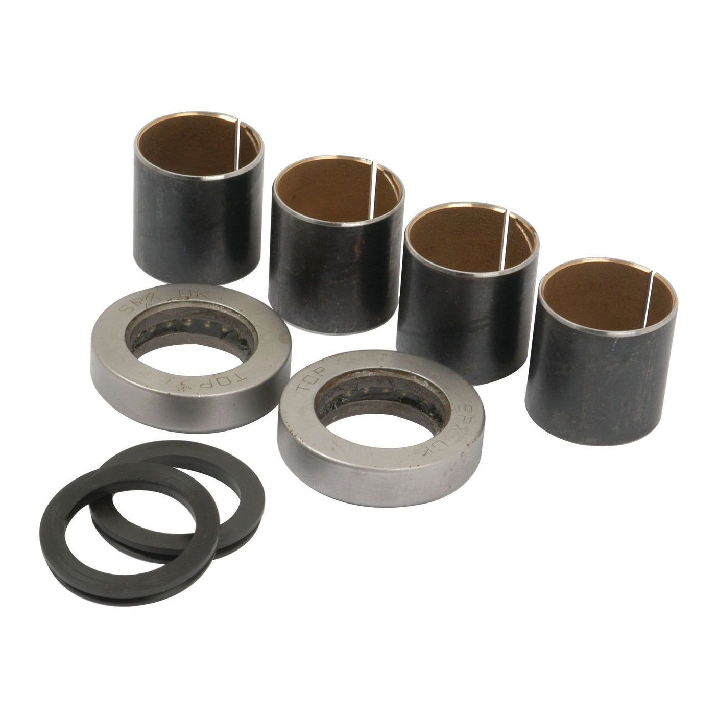 Six cylindrical bushings, including two labeled "TOP," and two rubber washers, are arranged on a white surface. These components appear to be part of the Spindle Repair Kit for Ford / New Holland tractors, known as Sparex Part No. S.65110 by the brand Sparex.