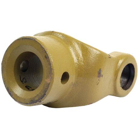 A yellow metal mechanical component with cylindrical holes on both ends, possibly part of a larger machine or engine, might be the Sparex PTO Yoke - Pinhole Yoke (U/J Size: 30.2 x 92mm), Bore Ø40mm, Pin Ø: 13mm (Part No. S.6518).