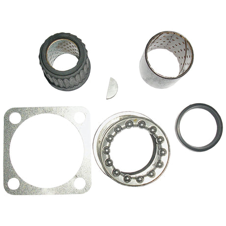 Various mechanical components, including a gasket, bearing, seals, and bushings arranged on a white background, showcase the precision of the Sparex Steering Box Seal Kit (Sparex Part No. S.65649).