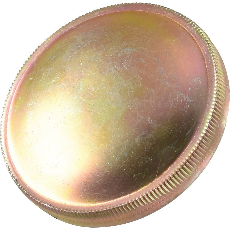 A round, metallic, and slightly tarnished copper Sparex Fuel Cap (S.65819) with a grooved edge, compatible as an internal metal bayonet for Ford/New Holland tractors.