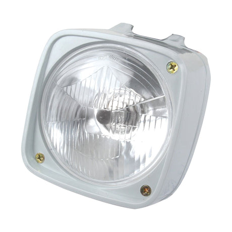 The Head Light, S.65853 from Sparex, features a square-shaped clear halogen headlight with a sturdy metal frame and four screws at the corners, ideal for vehicle installation. This IP65-rated unit ensures reliable performance in various weather conditions and is available in both RH and LH configurations with a LH dip at 12V.