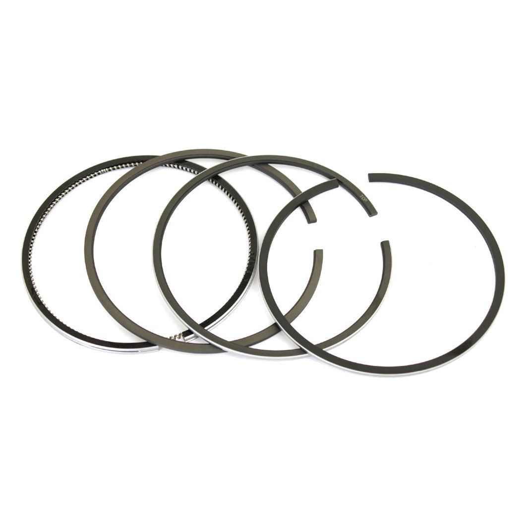 Image of four thin, black piston rings, including Sparex brand chrome plated rings (Sparex Part No.S.65997), arranged on a white background.