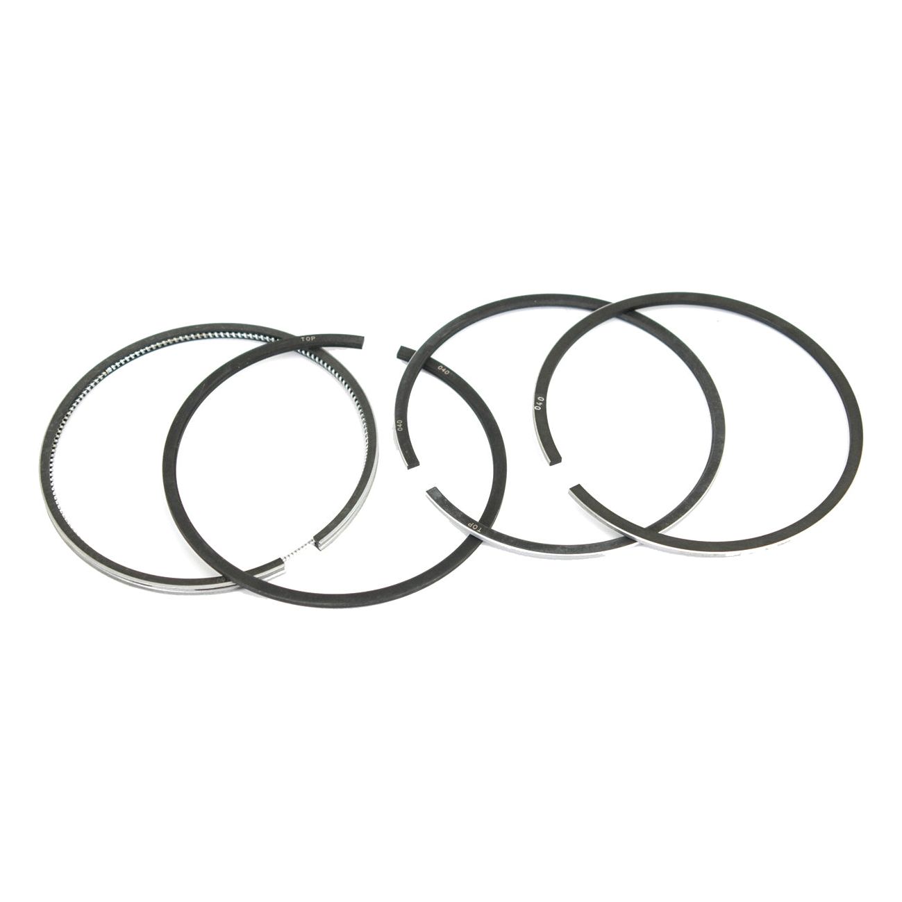 Image of four chrome-plated Piston Rings +0.040'' (1mm) arranged on a plain white background, typically used in internal combustion engines. This ring set, Sparex Part No. S.66060 by Sparex, is compatible with Ford New Holland machinery.