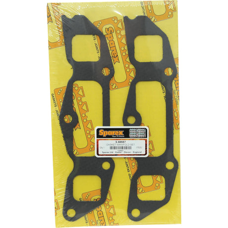 Two black exhaust manifold gaskets are mounted on a yellow cardboard backing featuring "Sparex" logos. The packaging, designed for New Holland and Ford engines, has a clear plastic cover and a central product label displaying the part number, S.66557, and other details.