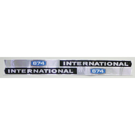 A metallic badge from the Decal Set - Case IH / International Harvester IH 674 | Sparex Part No.S.67754, featuring "INTERNATIONAL 674" in bold black letters with a blue and white "674" emblem on both ends, reminiscent of the classic International Harvester design. This authentic decal set by Sparex pays homage to the legacy of Case IH equipment.