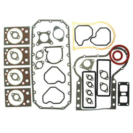 The Complete Gasket Set - 4 Cyl. (Sparex Part No. S.71293) by Sparex for Zetor 4-cylinder engines, features an array of automotive gaskets and seals neatly arranged on a white background. This set includes rubber and metal gaskets in various shapes and sizes, along with multiple O-rings.