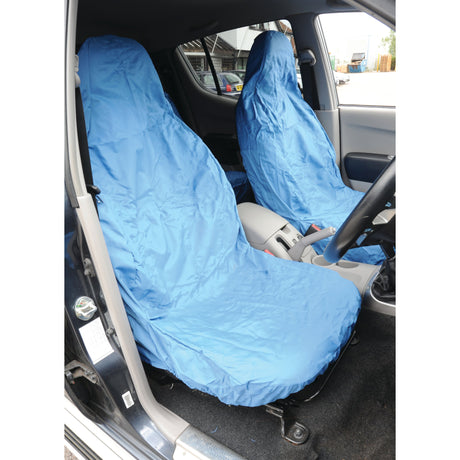 The car's interior showcases front seats covered with light blue, washable Sparex Front Large Seat Covers (S.71859), which offer a universal fit for cars and vans.