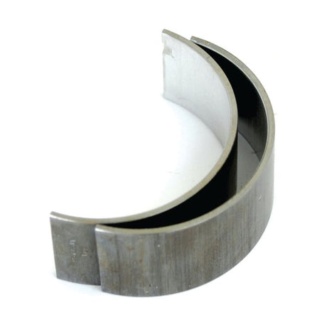 A semi-circular metallic Sparex Conrod Bearing +0.020'' (0.50mm) Pair (Sparex Part No.S.72109), featuring a smooth inner surface and a duller, textured outer surface, ideal for John Deere engines.