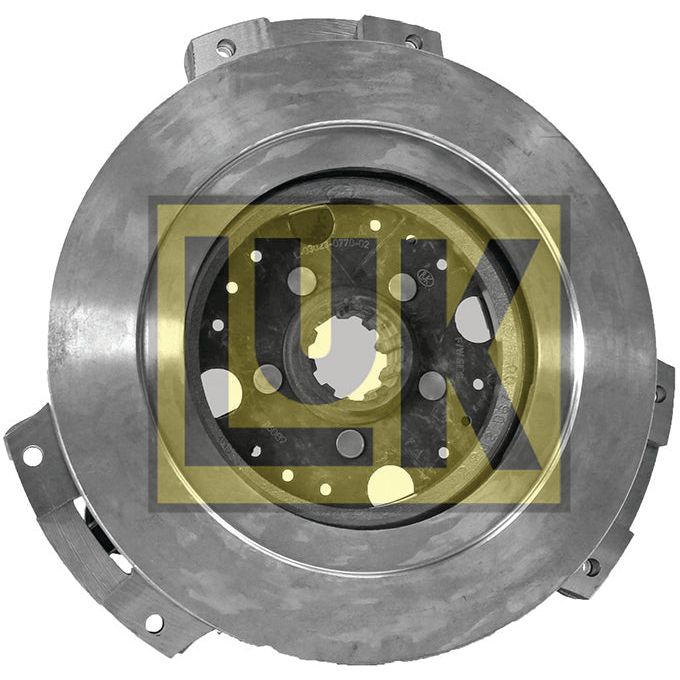 The Clutch Cover Assembly - S.73027 by Sparex is a metal clutch disc designed for a 23C 4 Cyl Diesel Engine. It features multiple holes and a central spline for mounting, utilizing high-quality captive disc material, with the "Sparex" logo emblazoned in yellow and black.