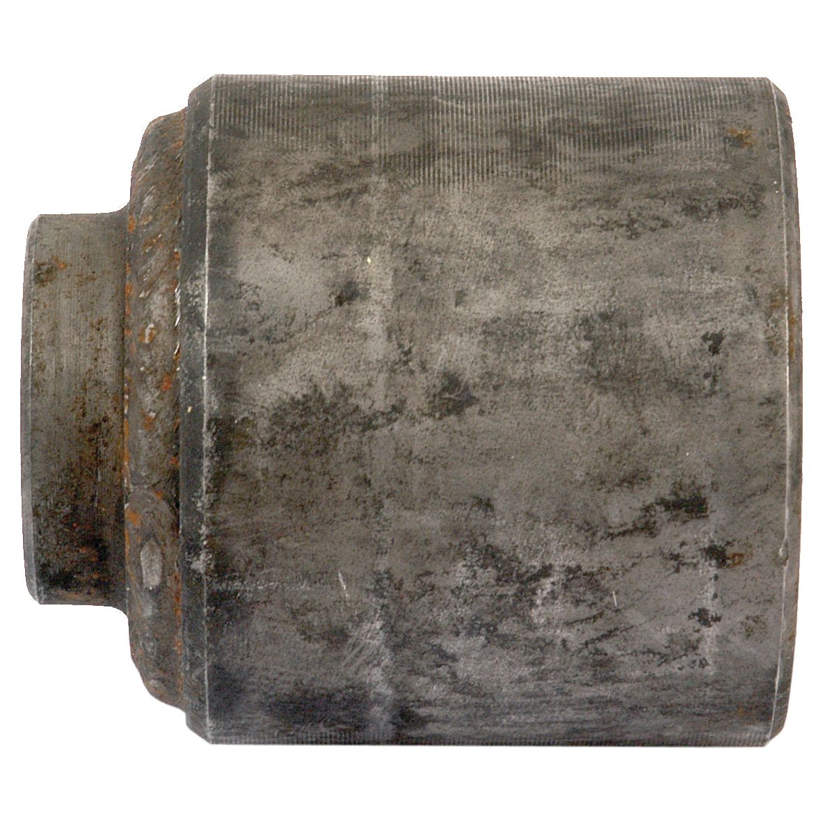 A close-up view of a worn cylindrical metal object, the Sparex Coupling (Sparex Part No. S.74190), with a smaller cylindrical extension on one end. The surface shows signs of rust and abrasion, resembling an aged coupling found in David Brown machinery.