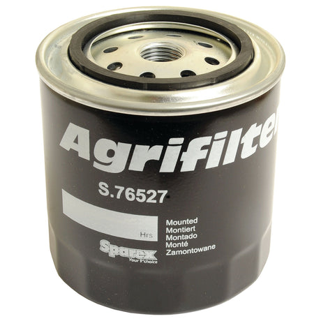 A water filter branded as "Sparex" with the part number "S.76527" printed on it. The filter, which is compatible with Ford New Holland machines, also has text related to mounting instructions.