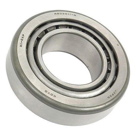 Close-up view of a cylindrical Sparex Taper Roller Bearing (M802048/M802011) - S.7786 with visible inner and outer rings and ball bearings. Markings include "KOYO," "JAPAN," and "HI-CAP.