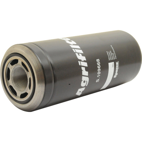 Close-up of a black cylindrical hydraulic filter with metallic ends labeled "Sparex S.109668," compatible with Ford New Holland and Case IH models.