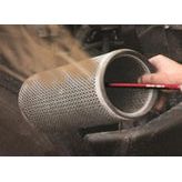 A person cleaning a cylindrical air filter with the Sparex Air comb 60cm - Red - S.151749 as dust is being blown out by the high-pressure air output.