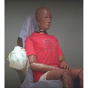 A crash test dummy, outfitted with the Sparex Airbag Compatible Seat Cover - Car & Van - Universal Fit (Sparex Part No. S.71898), is seated in a testing environment as an inflated airbag deploys beside it. This setup ensures reliable results across various vehicle models due to its universal fit design.
