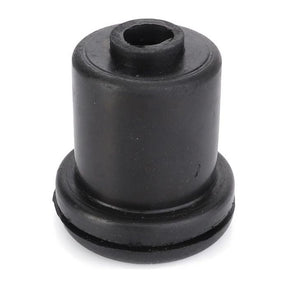 A close-up of the AGCO Massey Ferguson Ammeter Grommet (product code 897074M1) reveals its black rubber construction, featuring a cylindrical shape with a central hole and a wider base, characteristic of the durable components used in Massey Ferguson’s 100 Series tractors.