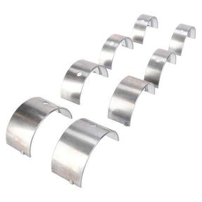 Eight metal bearing shells arranged in two staggered rows on a white background, reminiscent of essential AGCO parts from the Massey Ferguson 100 Series Bearing Kit Main (746156M91).