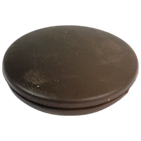 A round, flat, dark brown object with a smooth surface and slight textural imperfections, resembling the Sparex Blind Grommet Ø7/8'' x 1/16'' Groove (Part No. S.11348).