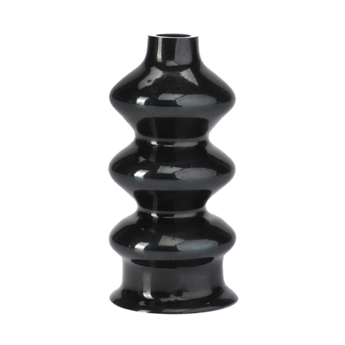 A black, glossy ceramic vase with vertically ribbed texture and undulating curves, featuring a narrow opening at the top, evokes the sleek design seen in vintage AGCO Massey Ferguson tractor parts like the 3901461M1 boot.