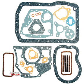 A collection of various tractor gaskets in different shapes and sizes, including the Sparex Bottom Gasket Set - 4 Cyl. (BMC 15T), Sparex Part No.S.58730, arranged together.