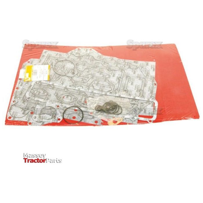 A Bottom Gasket Set for Massey Ferguson Tractor Parts, featuring a 6-cylinder design for Perkins Engine Models 1006.6, 1006.60T, and A6.354.4, from the brand Sparex (Sparex Part No.S.42398), laid out on a red surface and packaged in clear plastic wrapping.