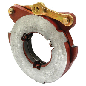 The Sparex Brake Actuator (Part No. S.40829) is a metal mechanical component with a circular shape, featuring a red housing, a central hole, and a gold-colored lever mechanism on top, designed to function as a brake actuator for Massey Ferguson and Ford New Holland machinery.