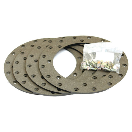 A set of four round Brake Lining Kits, specifically designed for Massey Ferguson and Landini machinery, includes a small plastic bag containing screws and washers from Sparex. (Sparex Part No. S.37265)