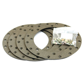Four round gaskets with multiple holes, suitable for Brake Lining Kit Disc (Sparex Part No. S.37265), and an accompanying small plastic bag containing hardware from the Sparex brand.