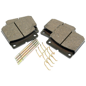 Set of four automotive brake pads with metal backing plates, four metal clips, and four small metal rods, arranged on a white background. Ideal for the JCB FASTRAC, this Brake Pad Set Rear (Sparex Part No. S.70802) by Sparex ensures optimal performance and reliability.
